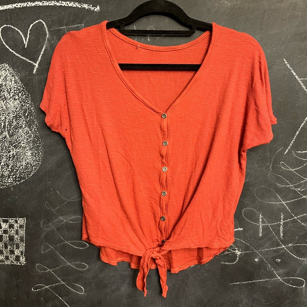Orange tee shirt with tie in front